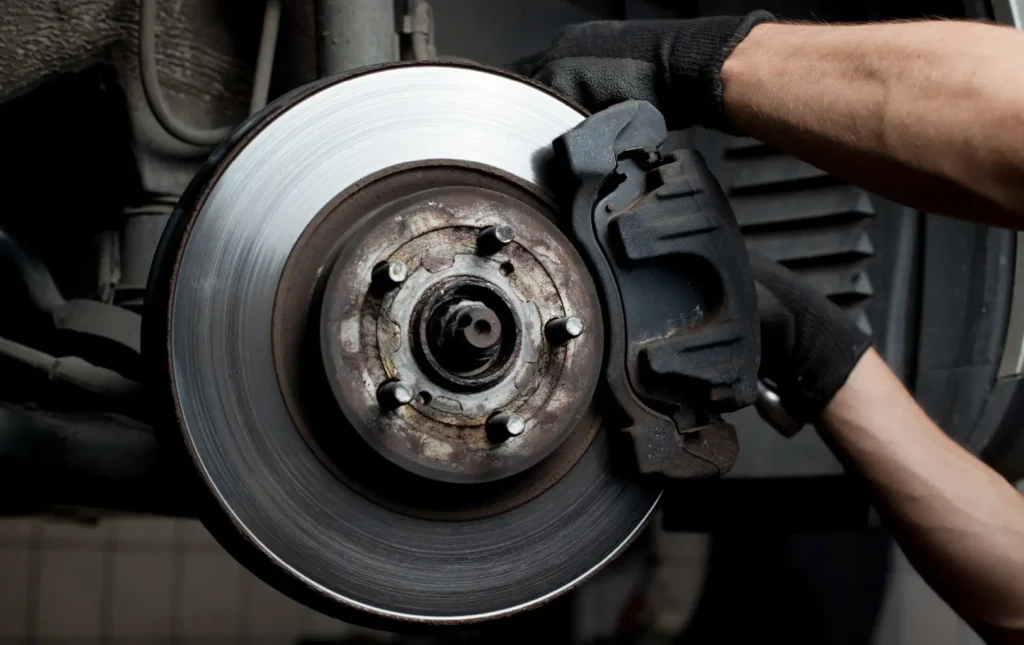 Technician servicing brakes